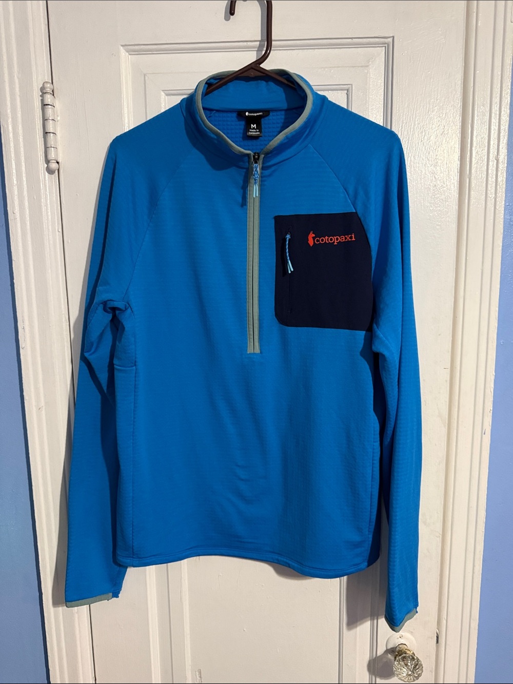 cotopaxi Bright Blue Half-Zip Sweater with Navy Chest Pocket